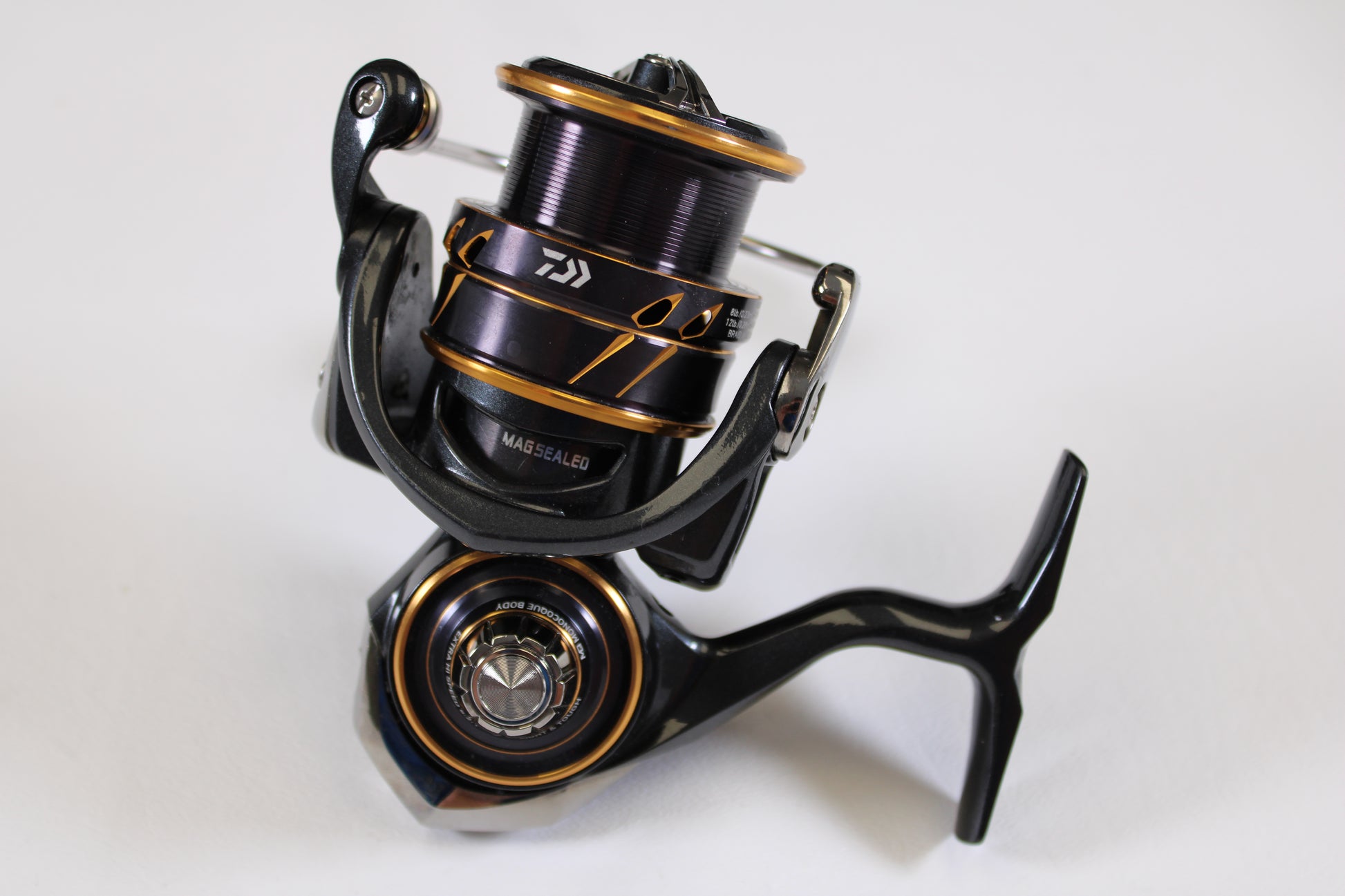 A close-up of the Daiwa Caldia LT 3000-CXH Used Spinning Reel in very good condition, shown on a white background—an ideal upgrade option through our Rod and Reel Trade-In Program.