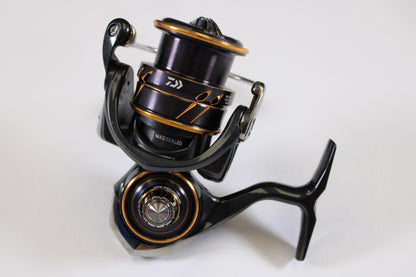 A close-up of the Daiwa Caldia LT 3000-CXH Used Spinning Reel in very good condition, shown on a white background—an ideal upgrade option through our Rod and Reel Trade-In Program.