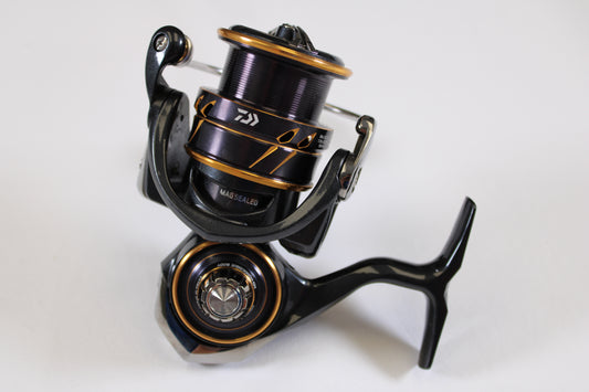 A close-up of the Daiwa Caldia LT 3000-CXH Used Spinning Reel in very good condition, shown on a white background—an ideal upgrade option through our Rod and Reel Trade-In Program.