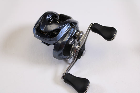 A close-up of the Shimano Aldebaran MGL ALDMGL51 6.5:1 LH Used Casting Reel in very good condition, perfect for upgrading with our Rod and Reel Trade-In Program—get store credit for your used Shimano gear.