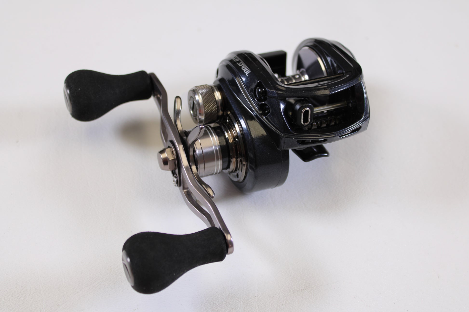 A close-up of Lew's BB1 Pro PRS1HZ 6.4:1 RH Used Casting Reel in excellent condition, with dual handles and sleek black design—ideal for upgrading through our Rod and Reel Trade-In Program for store credit.