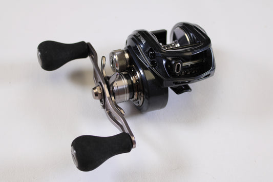 A close-up of Lew's BB1 Pro PRS1HZ 6.4:1 RH Used Casting Reel in excellent condition, with dual handles and sleek black design—ideal for upgrading through our Rod and Reel Trade-In Program for store credit.