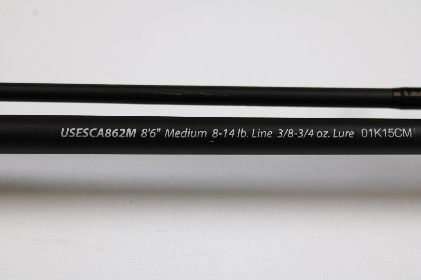 A close-up of the Shakespeare Ugly Stik Elite Salmon/Steelhead USESCA862M 8'6" Medium 2 Piece casting rod (Qty: 2, used, excellent condition)—ideal for our Rod and Reel Trade-In Program or used gear store credit.