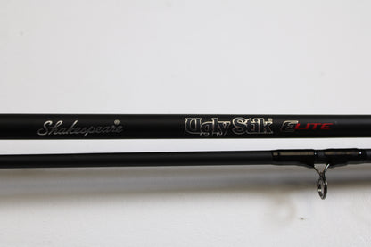 Close-up of a black Shakespeare Ugly Stik Elite Salmon/Steelhead USESCA862M 8'6" Medium 2 Piece used casting rod in excellent condition, available in Qty: 2—ideal for those trading in gear for store credit through our Rod and Reel Trade-In Program.