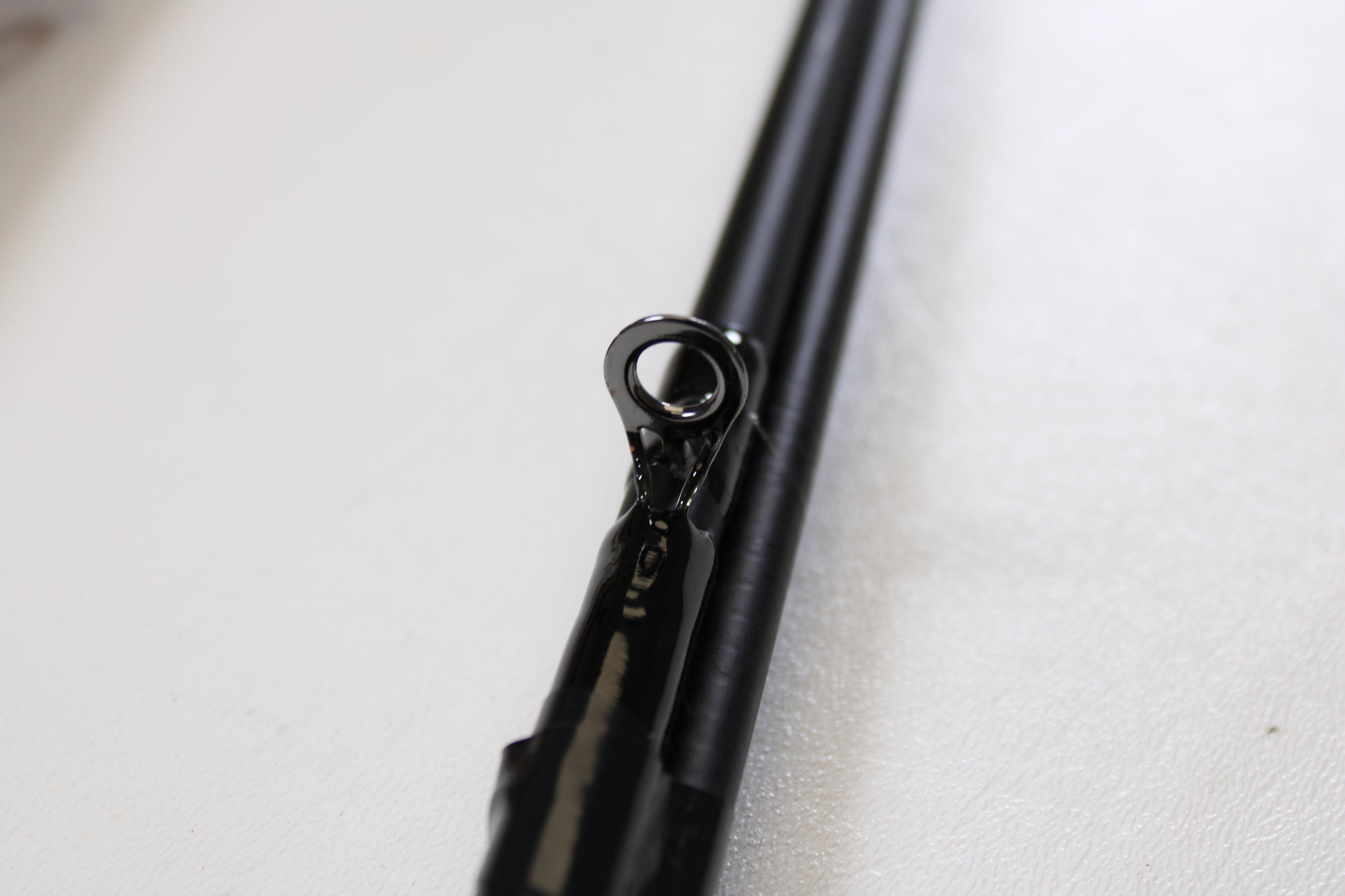 Close-up of the Shakespeare Ugly Stik Elite Salmon/Steelhead USESCA862M 8'6" Medium 2 Piece Used Casting Rods (Qty: 2, Excellent Condition)—ideal for anglers seeking an upgrade or trading in pre-owned fishing gear.