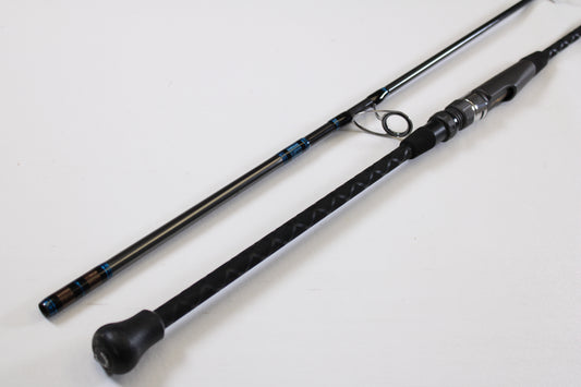 A close-up of the Tsunami Airwave Elite TSAWESS762LT 7'6" 2-piece used spinning rod in excellent condition, highlighting its textured handle and components—ideal for anglers seeking quality pre-owned gear or trade-in options.