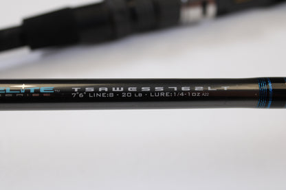 Close-up of the Tsunami Airwave Elite TSAWESS762LT 7'6" 2 Piece Used Spinning Rod in excellent condition—showing model details on a sleek black rod with blue accents. Perfect for rod and reel trade-ins or browsing quality used gear.