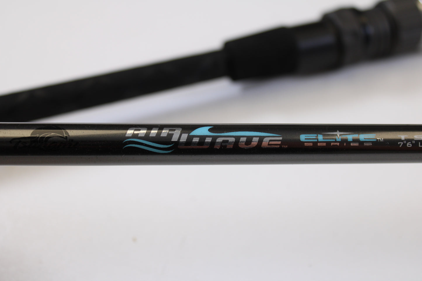 Close-up of the Tsunami Airwave Elite TSAWESS762LT 7'6" 2 Piece Used Spinning Rod in excellent condition, showing "Airwave Elite Series" text—ideal for our trade-in or used gear store credit offers.