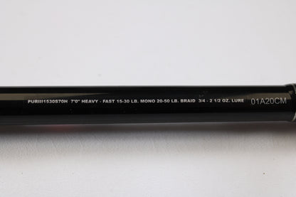 A close-up of the Penn Pursuit III PUTIII1530S70H 7'0" Heavy Used Spinning Rod (excellent condition) shows specs: "7’0’’ HEAVY - FAST 15-30 LB. MONO 20-50 LB. BRAID 3/4 - 2 1/2 OZ. LURE," ideal for trade-in or used gear shoppers.