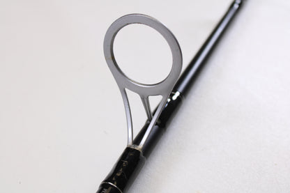 Close-up of the Penn Pursuit III PUTIII1530S70H 7'0" Heavy Used Spinning Rod's guide. Excellent condition, by Penn. Trade in your gear for store credit with our rod and reel program. Shown against a white background.