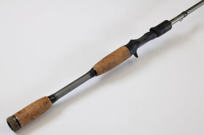 The Fenwick Elite Bass ELTB70MH-FC 7'0" Medium Heavy Used Casting Rod (very good condition) is shown—ideal for earning store credit with our Rod and Reel Trade-In Program.