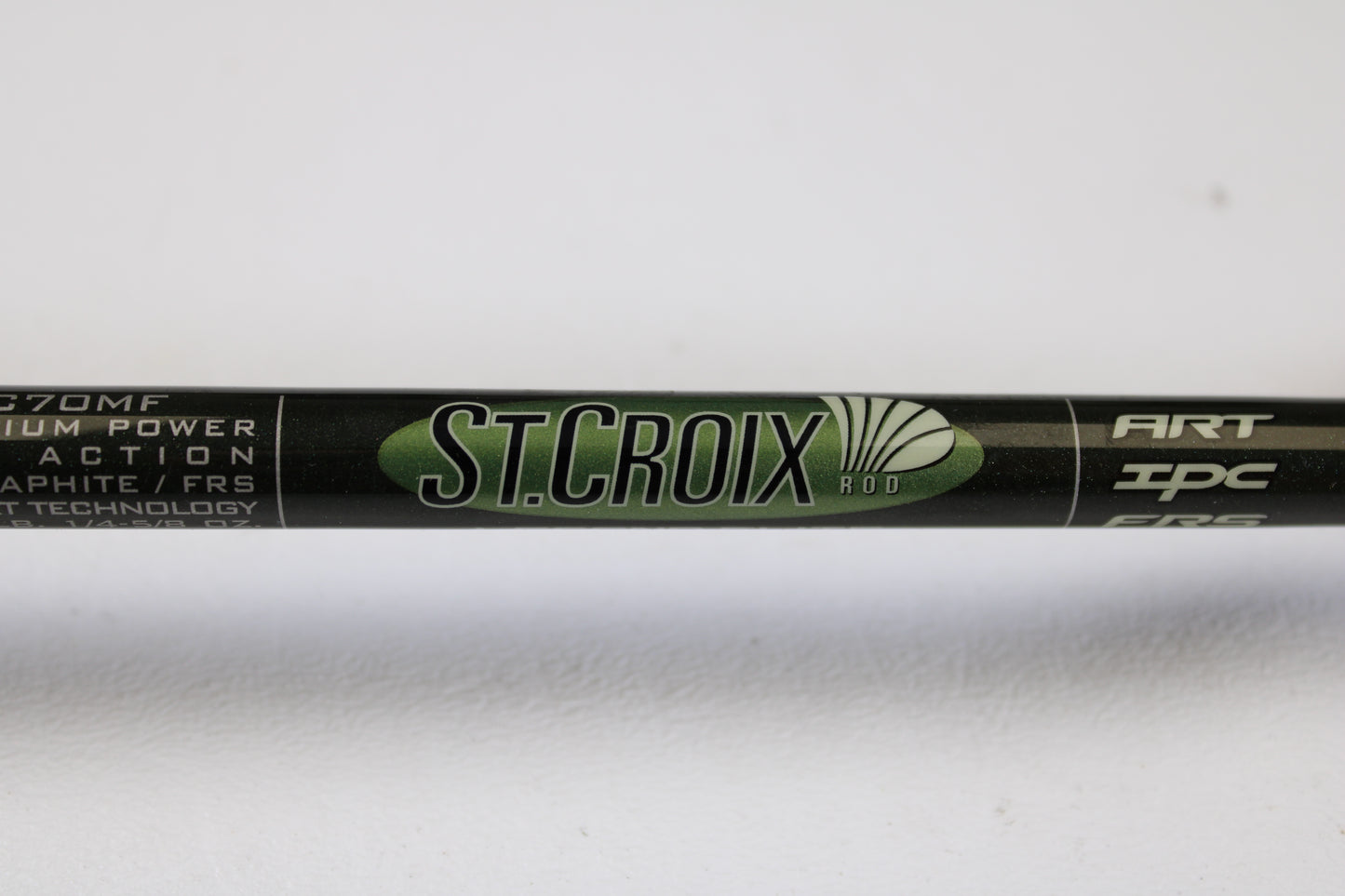 Close-up of the St. Croix Legend Elite EC70MF 7'0" Medium Used Casting Rod in excellent condition, shown in green and black with white specs. Trade in your gear through our Rod and Reel Trade-In Program for store credit.