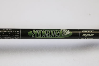 Close-up of the St. Croix Legend Elite EC70MF 7'0" Medium Used Casting Rod in excellent condition, shown in green and black with white specs. Trade in your gear through our Rod and Reel Trade-In Program for store credit.