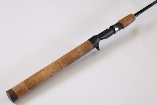 A close-up of the St. Croix Premier Crankbait PC66MM 6'6" Medium Casting Rod's cork grip and black reel seat—used, very good condition—perfect for upgrading through our Rod and Reel Trade-In Program for store credit on your used St. Croix gear.