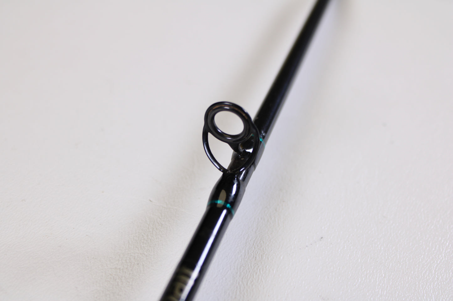 Close-up of the St. Croix Premier Crankbait PC66MM 6'6" Medium used casting rod in very good condition, highlighting its black guide and teal accents—ideal for quality gear seekers in our Rod and Reel Trade-In Program.