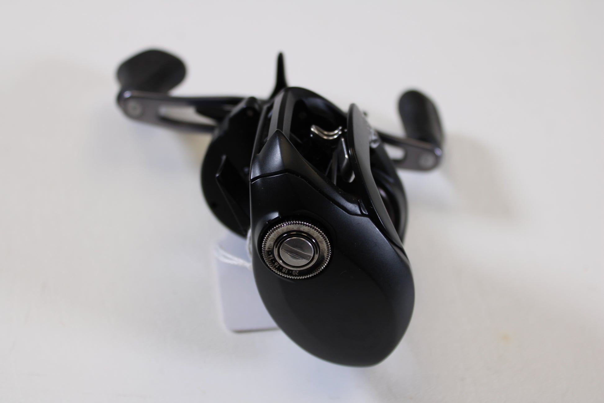 A detailed close-up of a Daiwa Tatula 150 TAT150P 5.5:1 RH - Used Casting Reel in excellent condition—ideal for those interested in trading used gear for store credit through our Rod and Reel Trade-In Program.