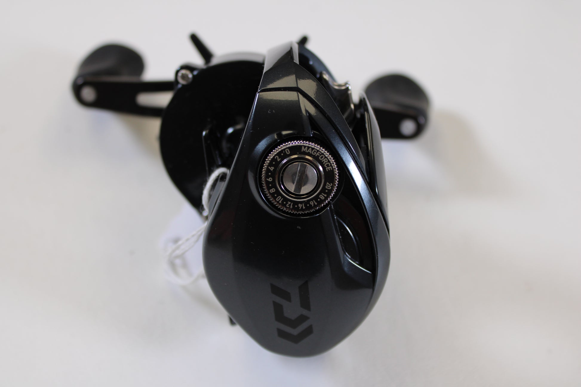A close-up of a Daiwa Tatula 300 TTU300P 5.3:1 RH used casting reel in excellent condition, with visible MAGFORCE dial and twin handles—ideal for anglers seeking pre-owned gear or rod/reel trade-in store credit.