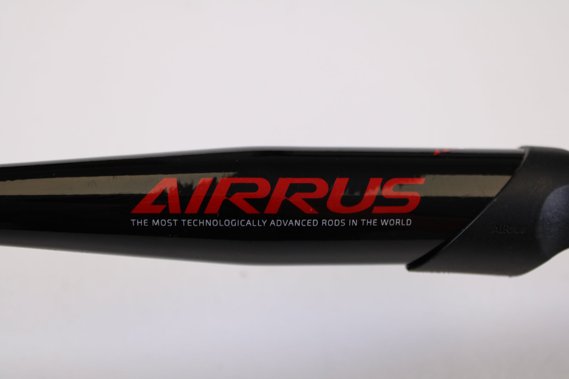 Close-up of the Airrus Stargate ASG681LF-S 6'8" Light Used Spinning Rod in excellent condition, featuring red "AIRRUS" branding and the slogan "THE MOST TECHNOLOGICALLY ADVANCED RODS IN THE WORLD," shown on a white background.