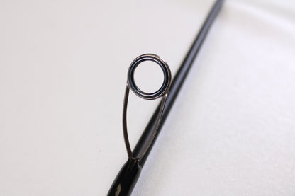 Close-up of the Airrus Stargate ASG681LF-S 6'8" Light Used Spinning Rod’s tip and metal guide ring against a white background—ideal for those looking to trade in or upgrade fishing gear for store credit.