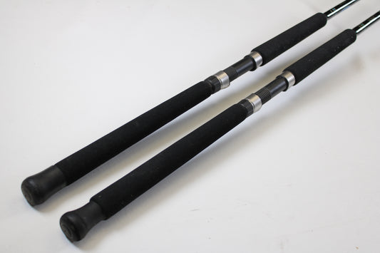 Two Cousins Tackle CLB 70XL-S 7'0" extra light used spinning rods, very good condition, lie parallel on a white surface—ideal for upgrading with our Rod and Reel Trade-In Program to earn store credit for your used gear.