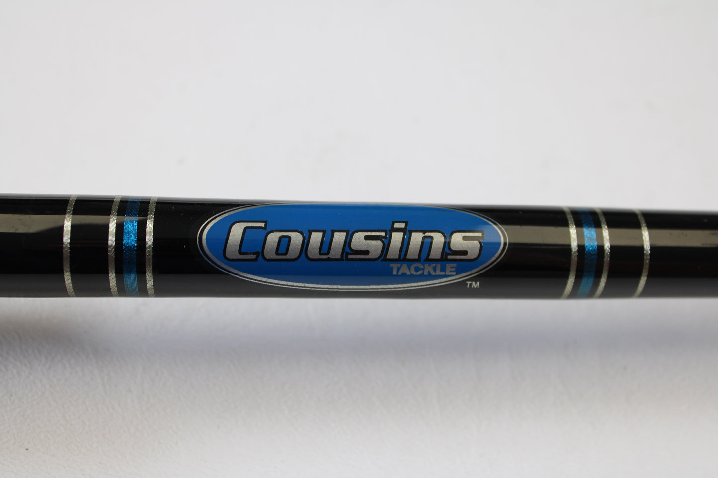 A close-up of a Cousins Tackle CLB 70XL-S 7'0" extra light spinning rod in black with blue and silver accents—Qty: 2, used in very good condition—ideal for our Rod and Reel Trade-In Program.