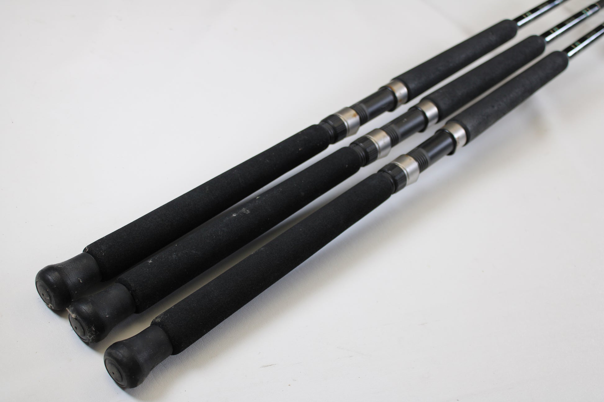 Three Cousins Tackle CLB 70L-S 7'0" used spinning rods (Qty: 3, very good condition) are shown—ideal for anglers seeking quality pre-owned gear or using our Rod and Reel Trade-In for store credit.
