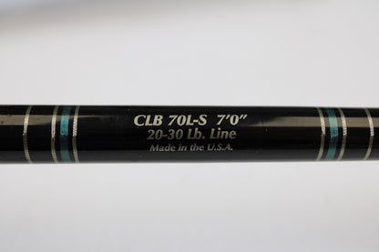 A close-up of a Cousins Tackle CLB 70L-S 7'0" used spinning rod (light, 20-30 lb line) in very good condition, showing “Made in the U.S.A.” text and blue/silver bands—possibly from our Trade-In program. Qty: 3.
