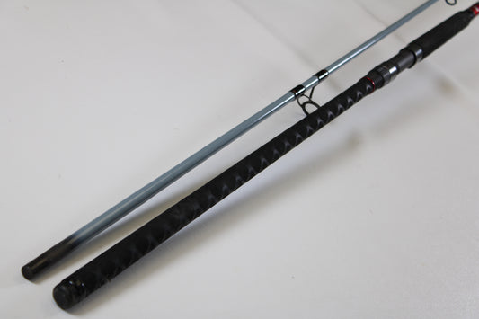 A close-up of the Daiwa Team Daiwa Surf TDSF1062MHFS 10'6" Medium Heavy Used Spinning Rod in very good condition showcases quality gear eligible for our Rod and Reel Trade-In Program.
