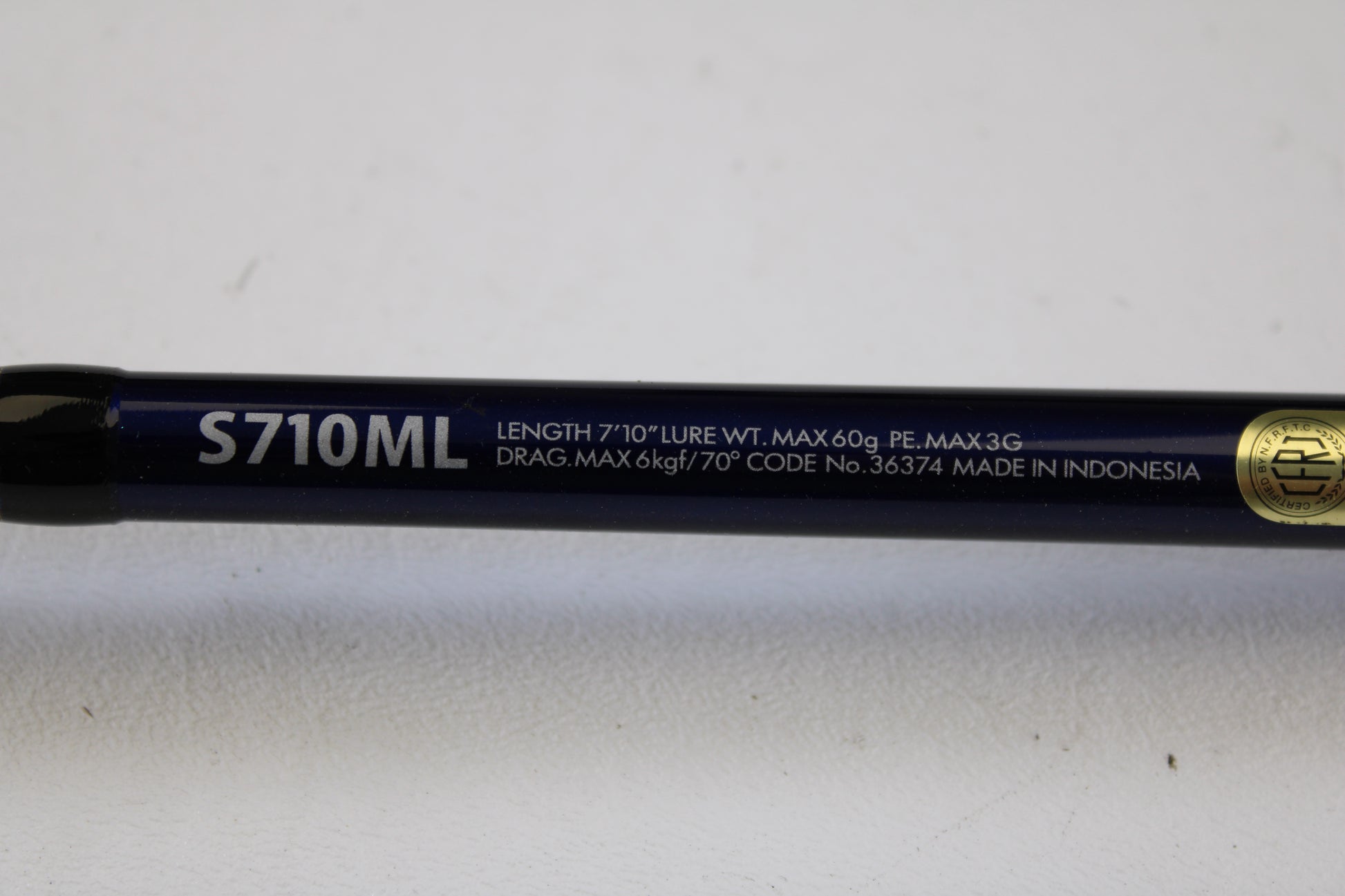 Close-up of a Shimano Ocea Plugger Flex Limited 7'10" Medium Light 2 Piece Used Spinning Rod in excellent condition—eligible for our Rod and Reel Trade-In Program and store credit on used gear.