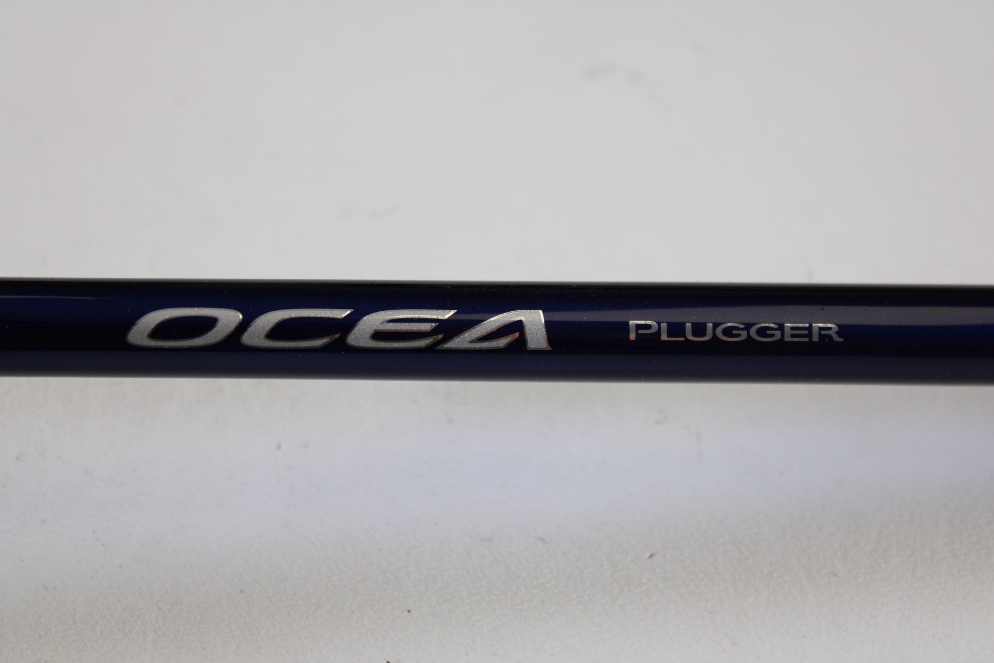 A close-up of the Shimano Ocea Plugger Flex Limited 7'10" Medium Light Used Spinning Rod—excellent condition—ideal for used gear seekers or those trading in rods and reels for store credit.