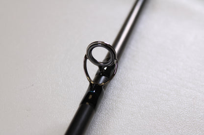 Close-up of a G. Loomis GLX FR1209 10'0" #9 2 Piece Used Fly Rod in excellent condition, highlighting its metal guide ring—ideal for trading in through our Rod and Reel Trade-In Program for store credit.