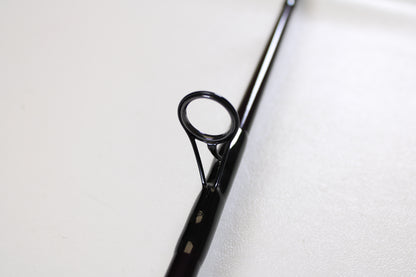 Close-up of a St. Croix Mojo Jig MJJS58XHMF 5'8" XH spinning rod guide, showing its circular eyelet and frame—ideal for anglers seeking used gear or a trade-in for store credit. Mint condition from St. Croix.