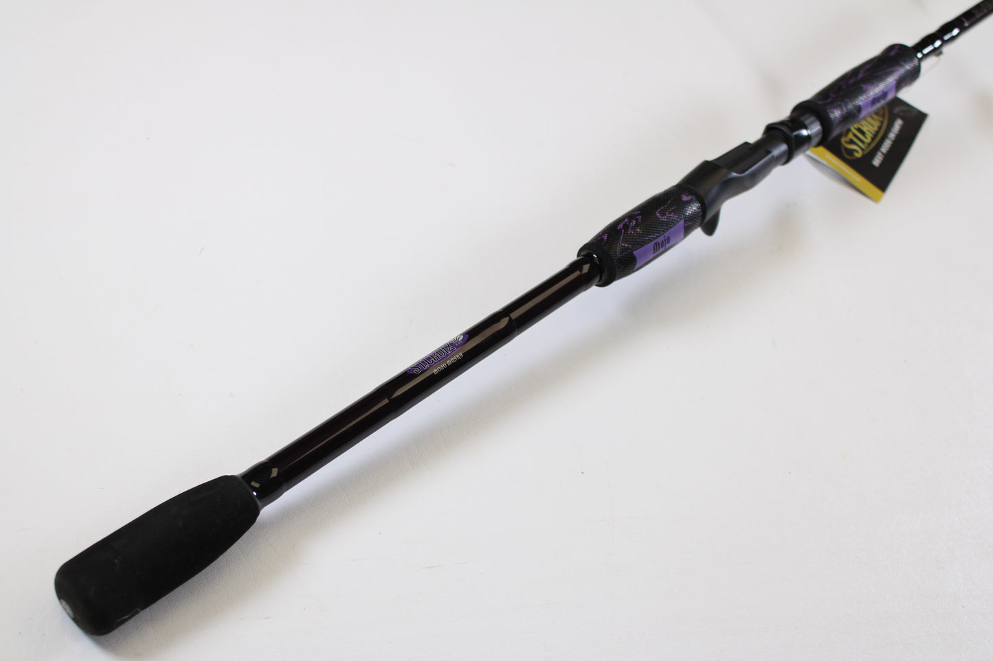 A close-up of a St. Croix Mojo Musky MJM80MHF 8'0" Medium Heavy used casting rod in mint condition is shown against a white background—perfect for those seeking quality gear or trading in with the Rod and Reel Trade-In Program.