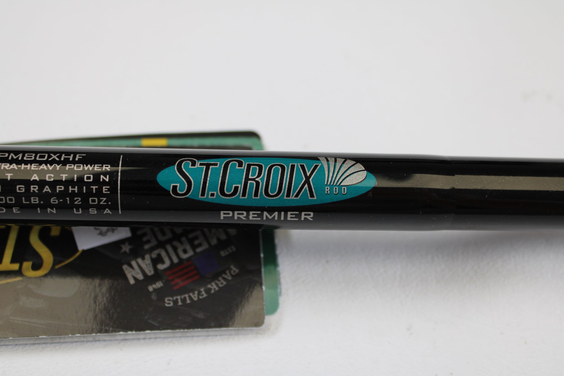 Close-up of a St. Croix Premier Musky PM80XHF 8'0" XH Used Casting Rod in mint condition, featuring its sleek black design and visible logo—ideal for anglers seeking quality used gear or learning about our rod and reel trade-in program.