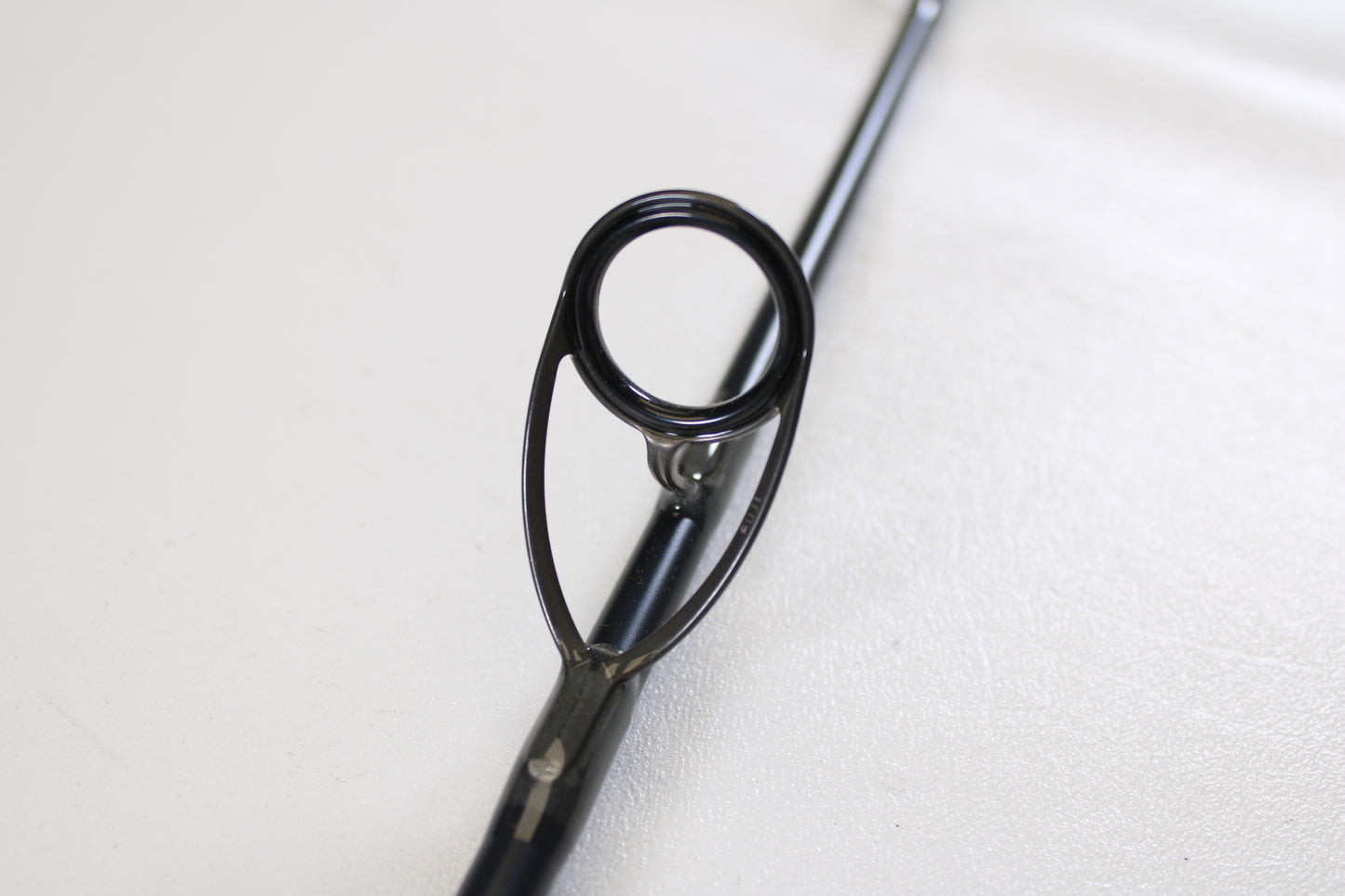 Close-up of a St. Croix Rift Jig RIFSJ58H 5'8" Heavy used spinning rod guide ring, shown against a plain white background. Trade in your gear for store credit with our Rod and Reel Trade-In Program. Brand: St. Croix, Mint Condition.