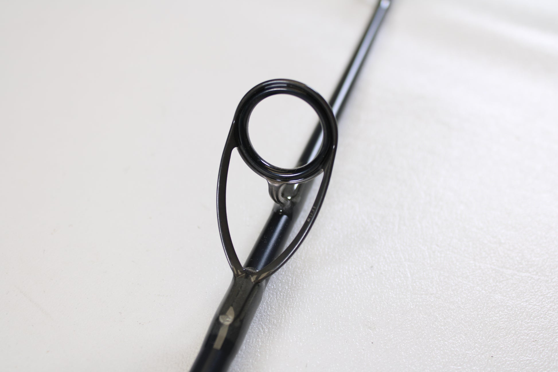 Close-up of a St. Croix Rift Jig RIFSJ58H 5'8" Heavy used spinning rod guide ring, shown against a plain white background. Trade in your gear for store credit with our Rod and Reel Trade-In Program. Brand: St. Croix, Mint Condition.