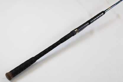A close-up of a St. Croix Seage SES70MMF 7'0" Medium Used Spinning Rod handle shows a textured grip, metal reel seat, and cork end cap—ideal for upgrading through our Rod and Reel Trade-In Program for store credit.