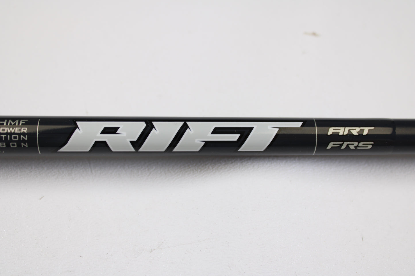 A close-up of the St. Croix Rift RIFSC73MHMF 7'3" Medium Heavy Used Conventional Rod in mint condition with "RIFT" in silver letters—ideal for those interested in our rod and reel trade-in program.