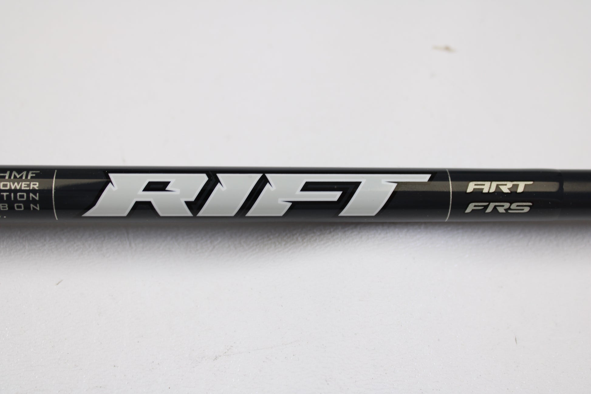 A close-up of the St. Croix Rift RIFSC73MHMF 7'3" Medium Heavy Used Conventional Rod in mint condition with "RIFT" in silver letters—ideal for those interested in our rod and reel trade-in program.