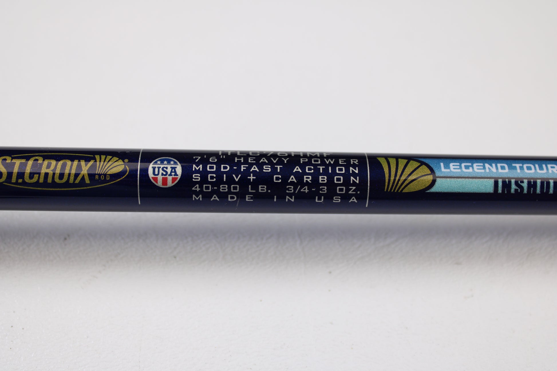 Close-up of a St. Croix Legend Tournament Inshore ITLC76HMF 7'6" Heavy casting rod label. Mint condition used gear welcome for rod and reel trade-in—receive store credit on your next purchase!.