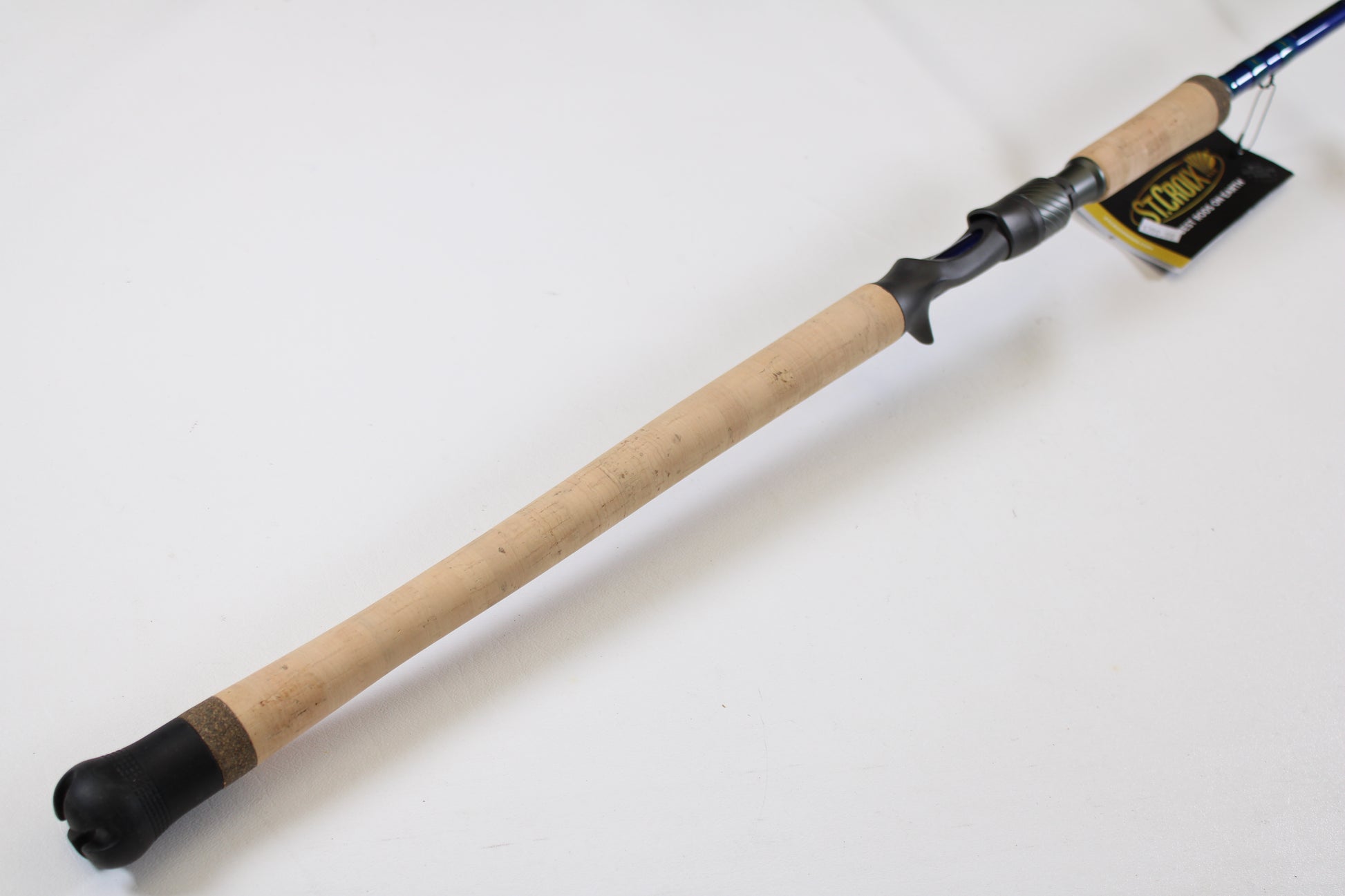 A close-up of the St. Croix Legend Tournament Inshore ITLC711HMF 7'11" Heavy Used Casting Rod in mint condition, featuring a cork handle and black reel seat—ideal for our Rod and Reel Trade-In Program. Shown on a plain white background.