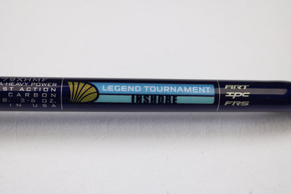 A close-up of a St. Croix Legend Tournament Inshore ITLC79XHMF 7'9" XH used casting rod in mint condition, featuring specs and a gold seashell logo on a blue and black background. Trade in your old gear for store credit with our Rod and Reel Trade-In Program.