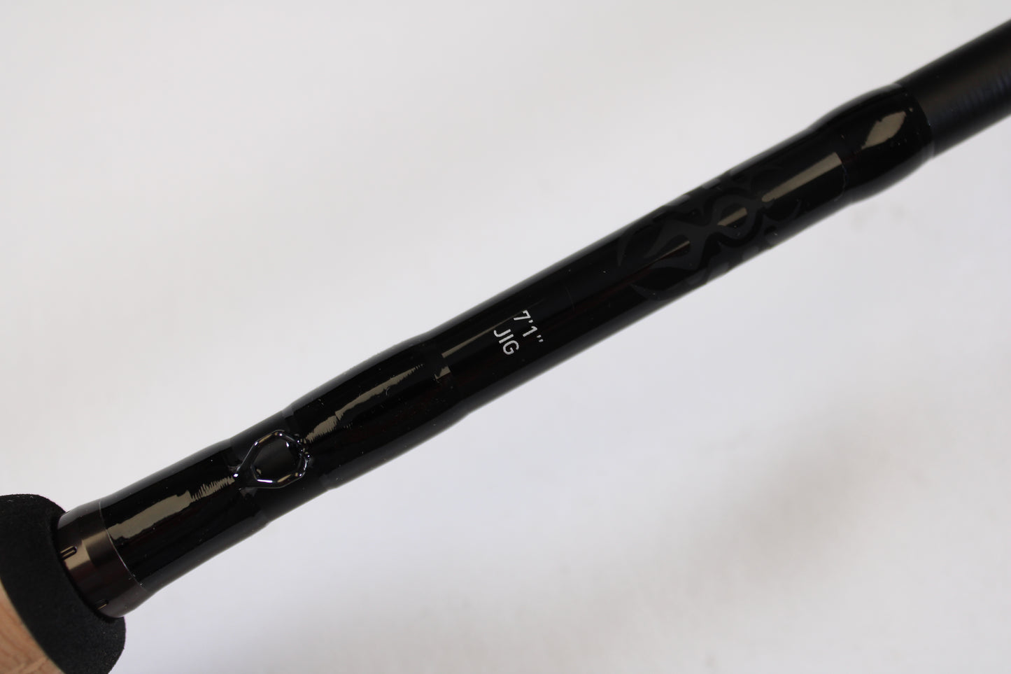 Close-up of a Daiwa Tatula TTU711HFB Used Casting Rod in mint condition, showing "7'1\" JIG" in white text on the black rod against a plain background. Handle is partially visible—ideal for your collection via our rod and reel trade-in program.