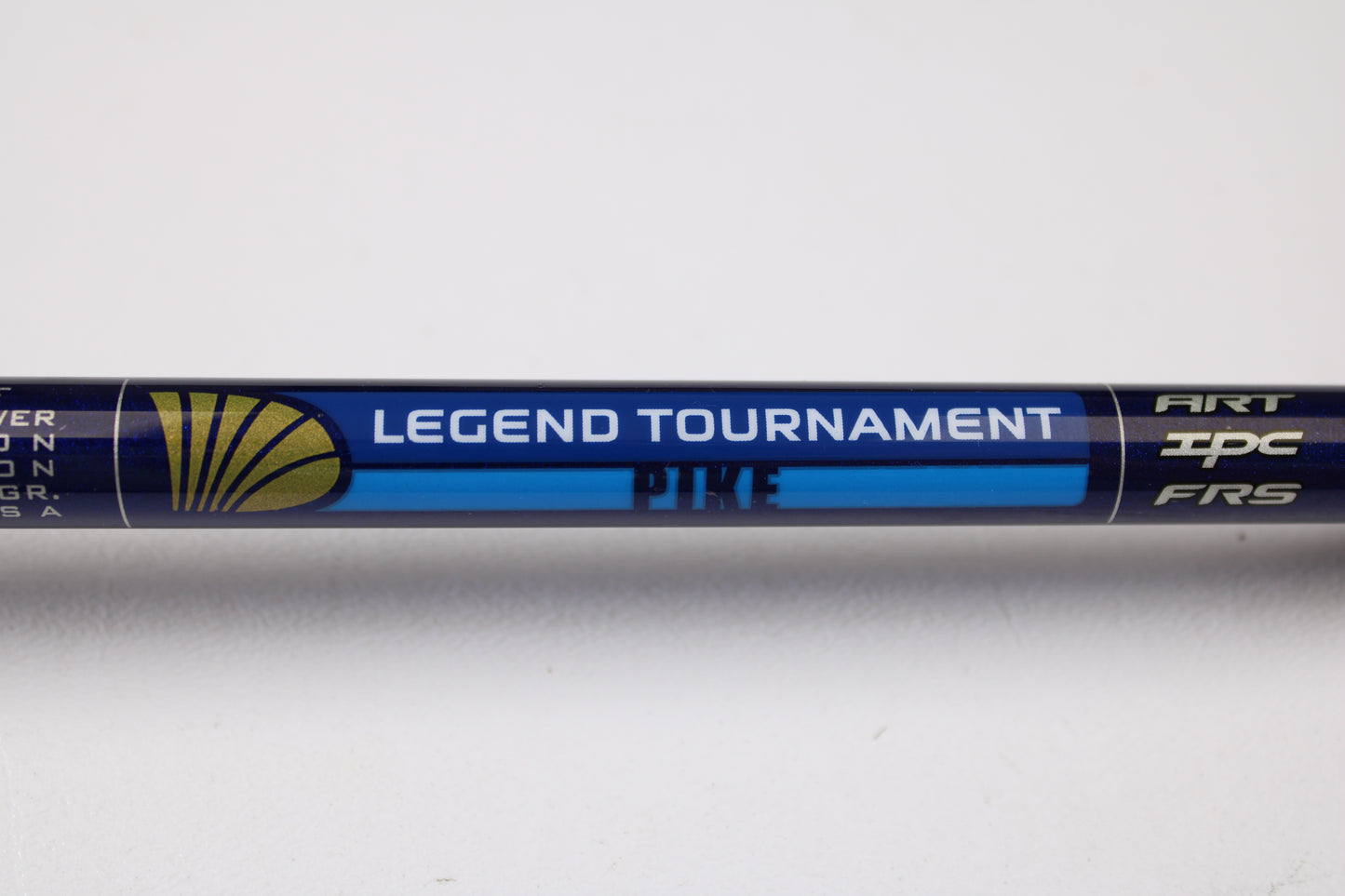 A close-up of a St. Croix Legend Tournament Pike LTPC223HF Slop-N-Tail 7'3" used casting rod—blue with gold and white accents, "ART," "IPC," and "FRS" markings—ideal for our Rod and Reel Trade-In or used gear shopping.