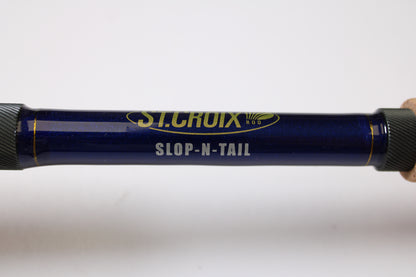 A close-up of a blue St. Croix Legend Tournament Pike LTPC223HF Slop-N-Tail 7'3" Medium Heavy Used Casting Rod in mint condition—perfect for upgrading through our Rod and Reel Trade-In Program.