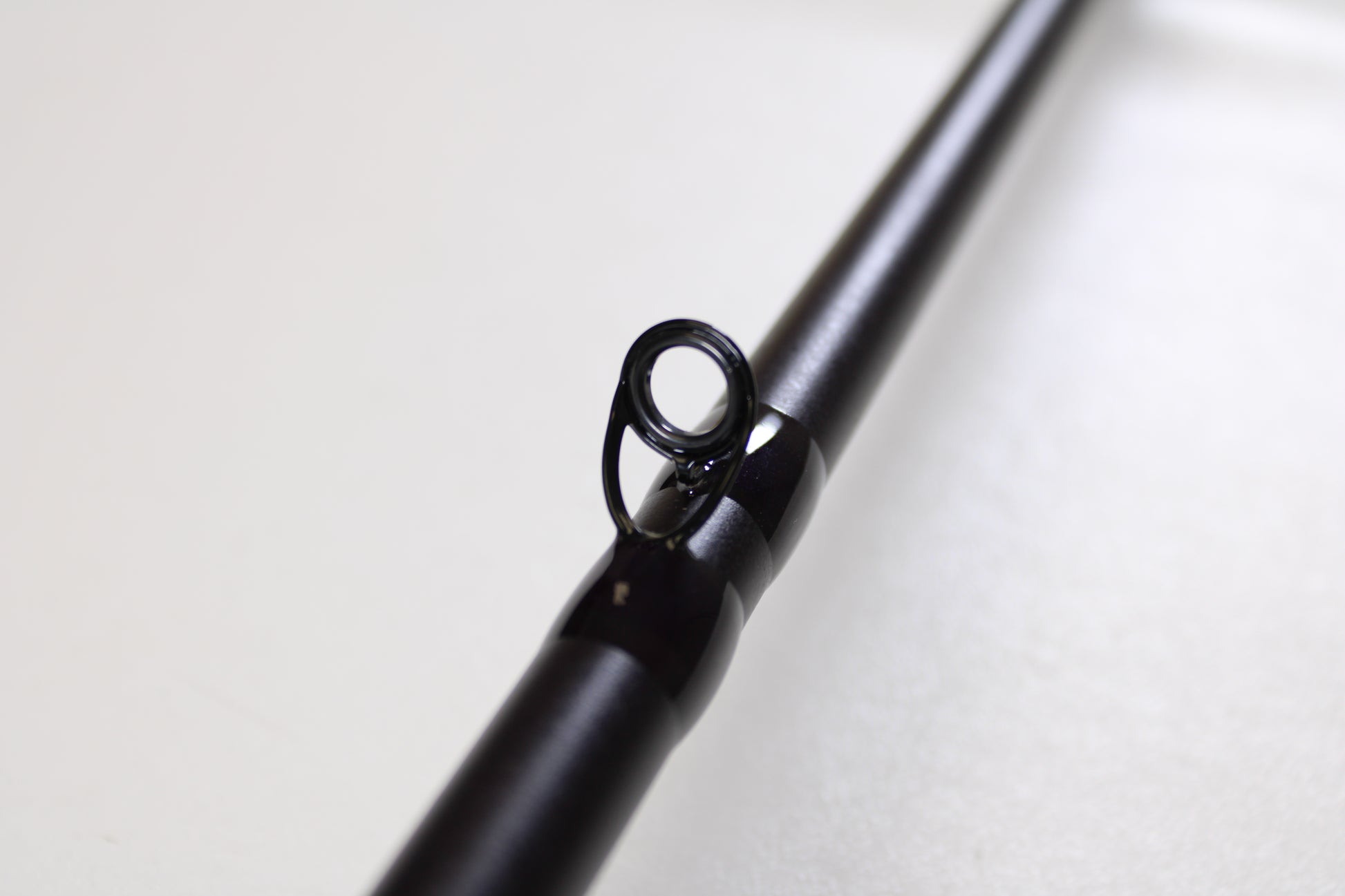 Close-up of the St. Croix Mojo Bass JOC710HF Lite Swimbait 7'10" Heavy Used Casting Rod—mint condition—with a detailed look at the eyelet, perfect for anglers interested in high-quality used St. Croix gear or a rod and reel trade-in for credit.
