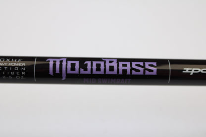 A close-up of a black St. Croix Mojo Bass JOC710XHF Mid Swimbait 7'10" XH used casting rod in mint condition, part of our used gear selection and potentially eligible for our Rod and Reel Trade-In Program. White specs are visible on the rod.