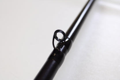 Close-up of the St. Croix Mojo Bass JOC710XHF Mid Swimbait 7'10" XH Used Casting Rod in mint condition, highlighting a line guide—great for highlighting your gear when trading in rods through our Rod and Reel Trade-In Program for store credit.