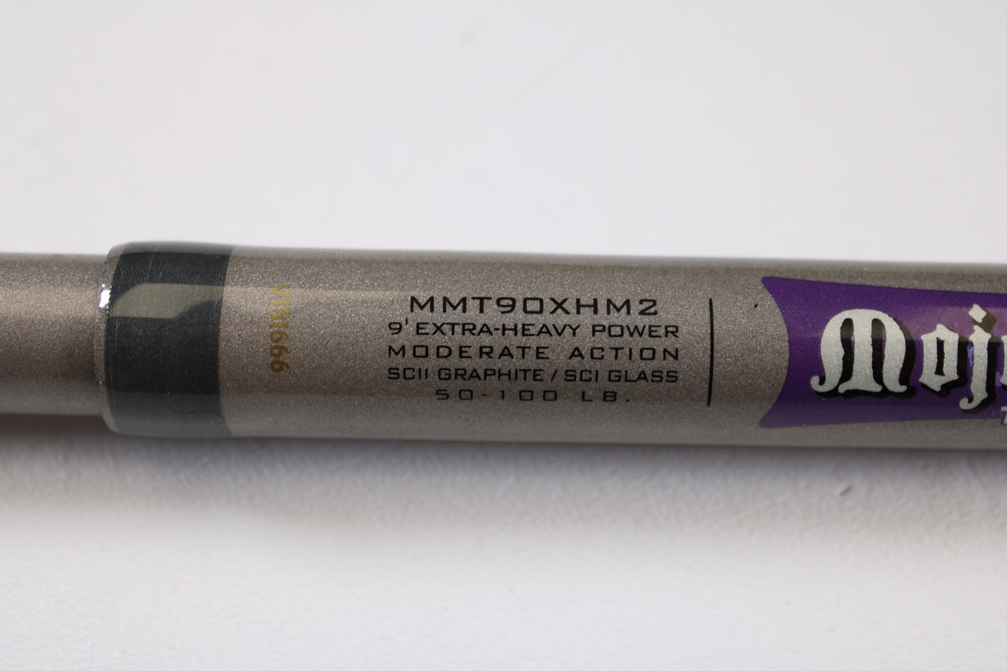 Close-up of St. Croix Mojo Musky Trolling MMT90XHM2 9'0" XH Used Casting Rod in metallic gray with a purple logo—ideal for store credit with our Rod and Reel Trade-In Program.