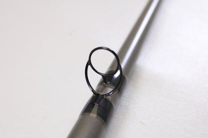 Close-up of the St. Croix Mojo Musky Trolling MMT90XHM2 9'0" XH used casting rod’s guide ring and support—ideal for anglers trading in gear for store credit with our Rod and Reel Trade-In Program. Mint condition. Set against a white background.